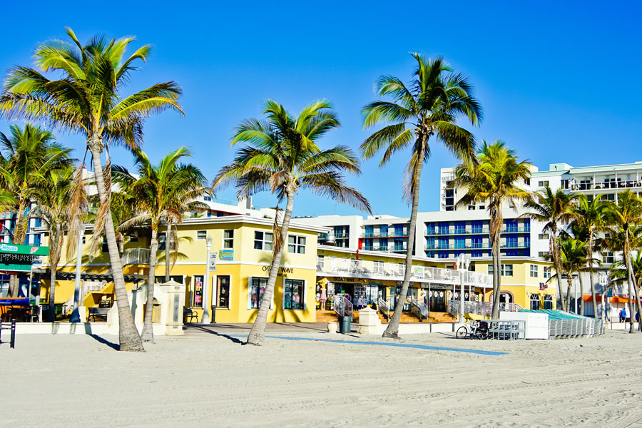 View of shops and hotels along the boardwalk of Hollywood Beach. 