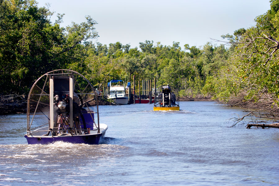 Airboats ride the River near Everglades City, Florida. Photo credit ShutterStock.com, licensed.