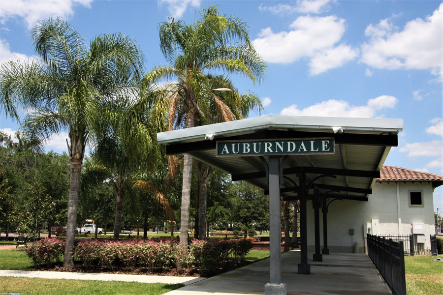 Auburndale Florida's palm trees and historic train station in its central City Park. 