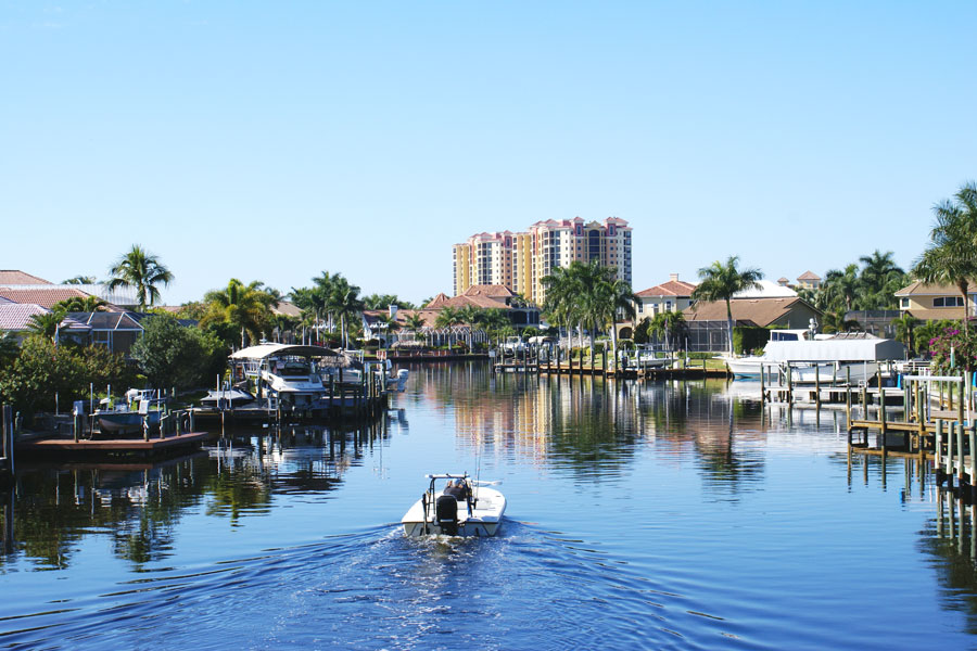 Boating along the canal in Cape Coral Florida. Photo credit ShutterStock.com, licensed.