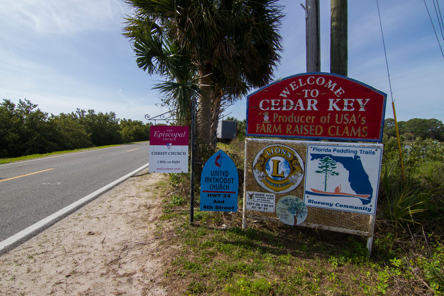 A welcome to Cedar Key sign as seen entering into Cedar Key, Florida on March 9, 2020. Editorial credit: Paulo Almeida Photography / Shutterstock.com, licensed.