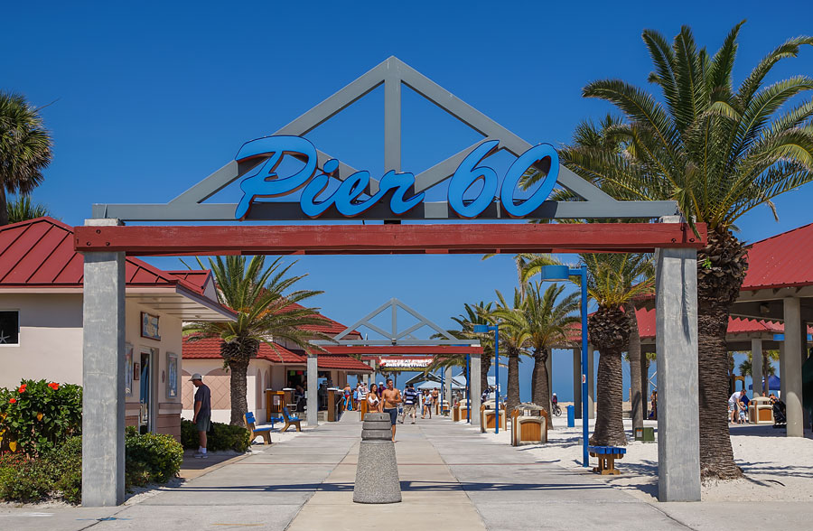 Welcome Sign in front of palm trees at Clearwater beach. Clearwater beach is a popular tourist destination on the Gulf coast of Florida. Clearwater Beach, Florida, May 18, 2013. 