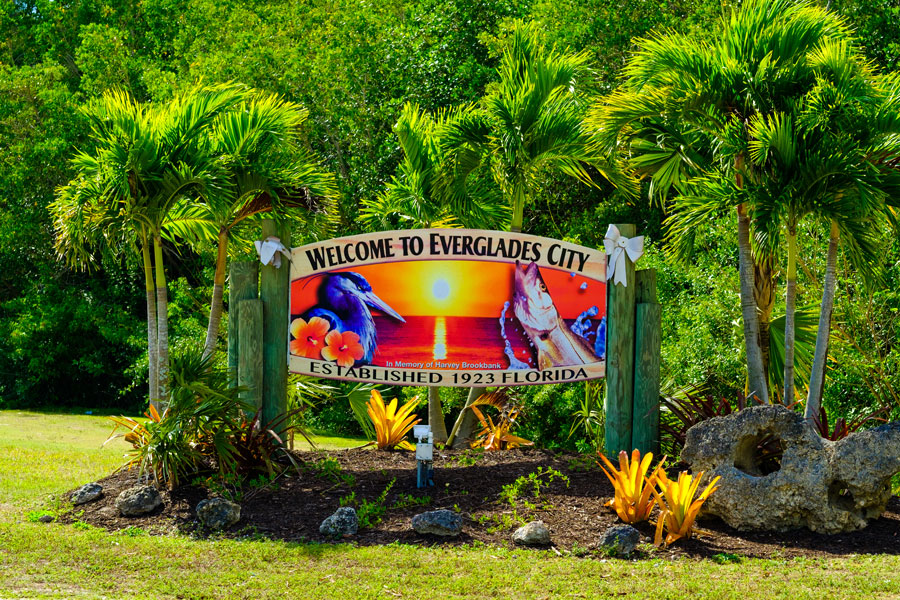 A colorful welcome sign to the small rural city located in the Florida Everglades. Everglades City, FL on January 26, 2017. Photo credit: Fotoluminate LLC, Shutterstock.com, licensed.