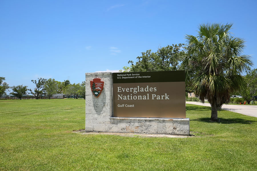 Everglades National Park Gulf Coast entrance sign at the entrance to the park, as seen on July 27, 2019. Everglades City, Florida. 