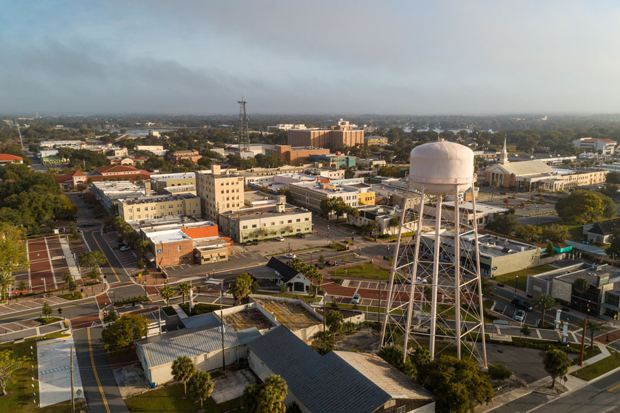 Aerial drone shot of downtown Winter Haven, FL on a sunny day. Editorial credit: Noah Densmore / Shutterstock.com, licensed.