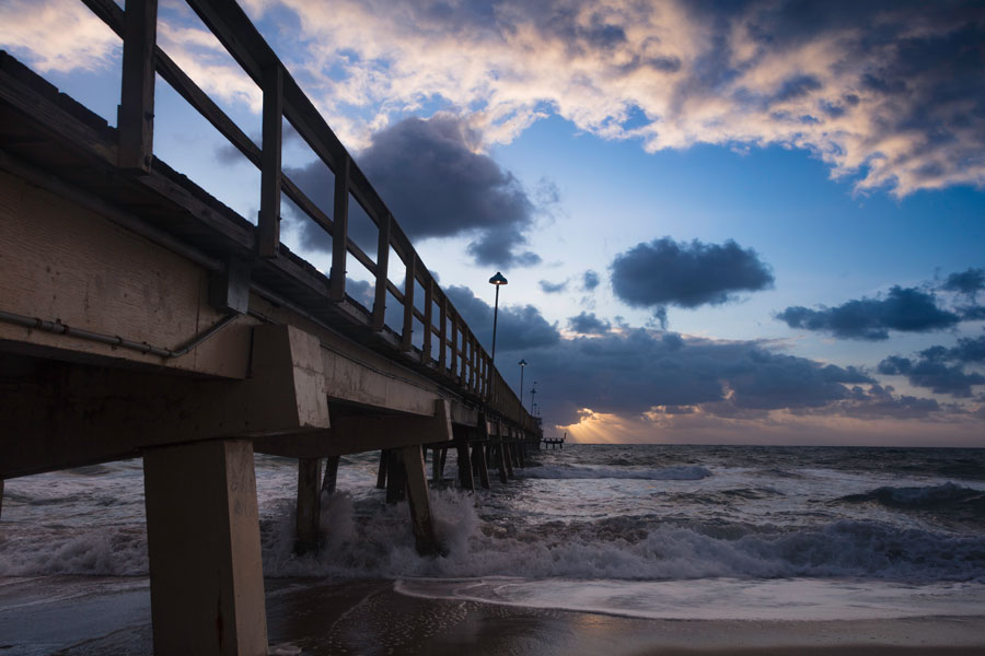 Pompano Beach Pier in Broward County Florida at the Beach at sunrise. 