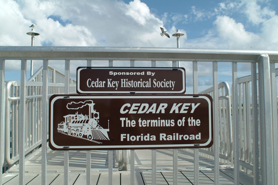 Sign for Cedar Key Pier on the Gulf Coast of Florida. Photo credit ShutterStock.com, licensed.