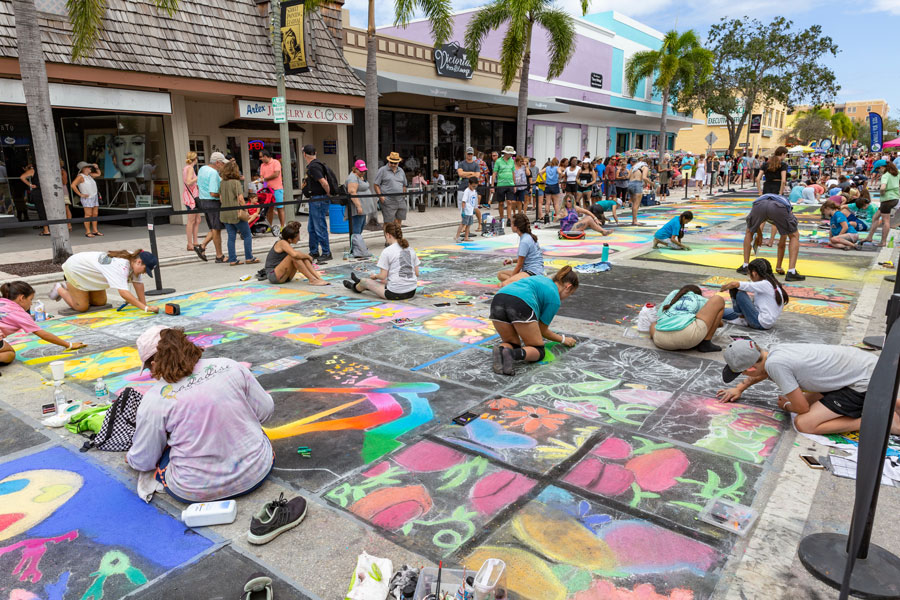 The Annual Street Painting Festival; artist everywhere as far as the eye can see all working hard on painting art on the streets of the small beach town. Lake Worth, Florida, February, 24, 2019. Editorial credit: Manny DaCunha / Shutterstock.com, licensed.