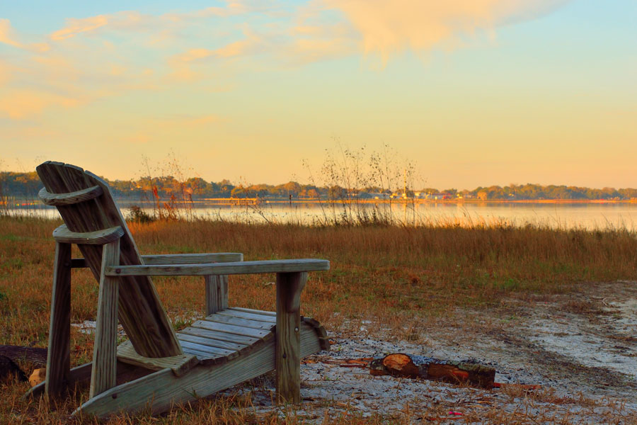 An Adirondack Chair Looking out to Lake Minneola, Clermont, Florida. Photo credit ShutterStock.com, licensed.