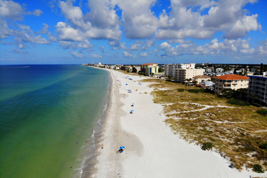 An aerial view of the beach and waterfront resorts hotel during the day on September 29, 2019. 