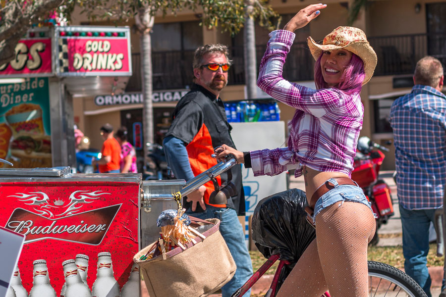 A bartender by bicycle during Bike Week event at Destination Daytona in Ormond Beach Florida. March 13, 2018. File photo: Edie Ann, Shutterstock.com, licensed.