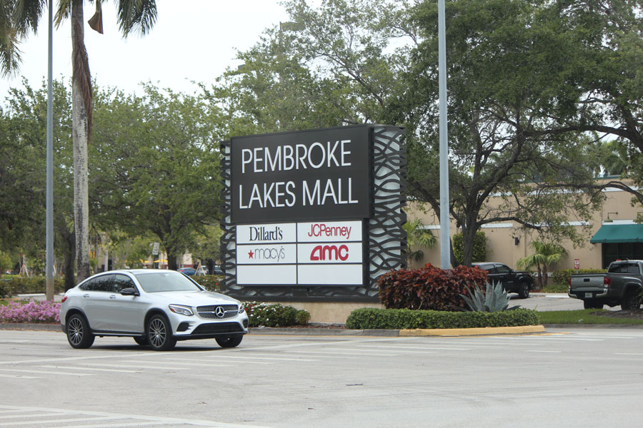 Pembroke Lakes Mall sign in Pembroke Pines Florida and a Mercedes Benz SUV. Pembroke Pines, FL, on April 30, 2020. File photo: Blueee77, Shutterstock.com, licensed.