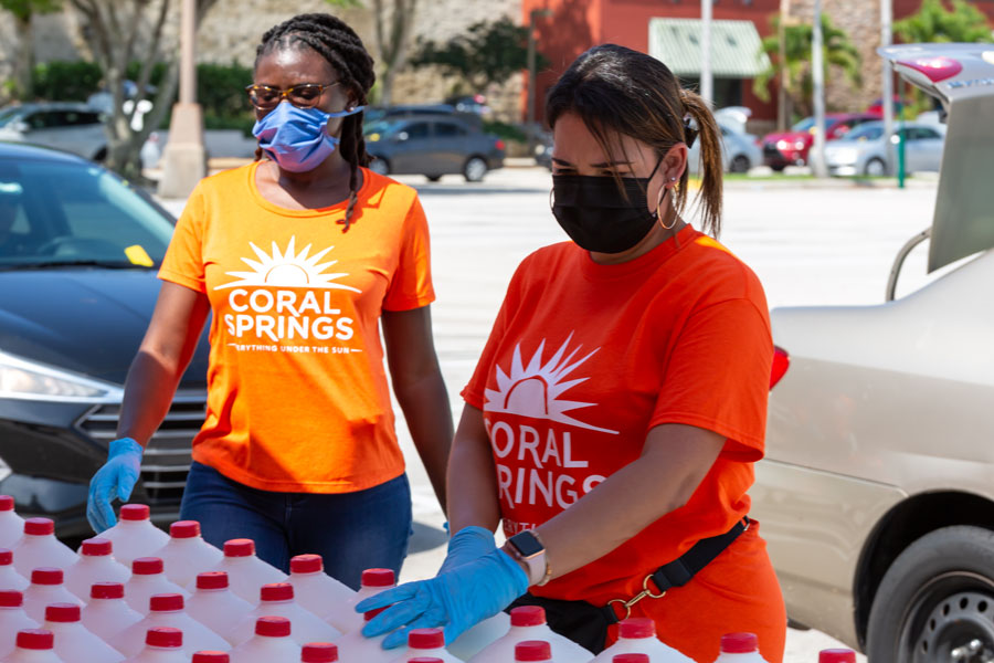 Food Distribution with Coral Springs Police Department officers and Coral Springs Fire Department at Coral Square Mall parking lot.