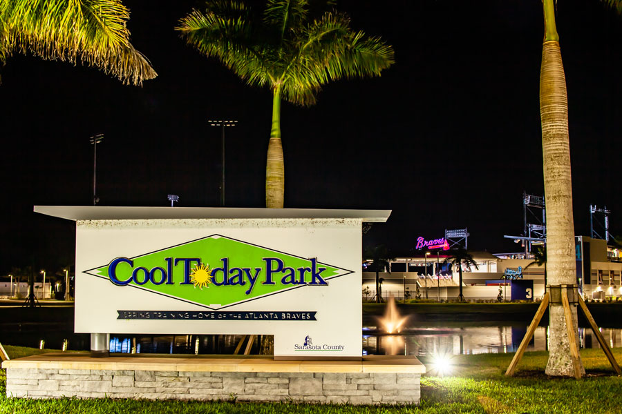 A night shot of the sign for the Atlanta Braves Spring training facility, Cool Today Park, with the baseball stadium in the background. File photo: Kent E Roberts, Shutter Stock, licensed.