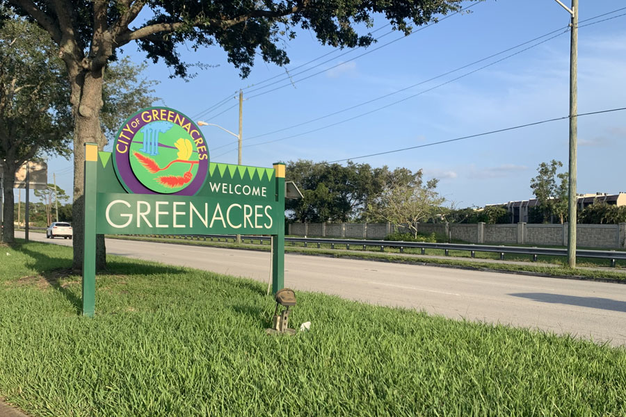 A sign welcomes drivers to the City of Greenacres in Palm Beach County.