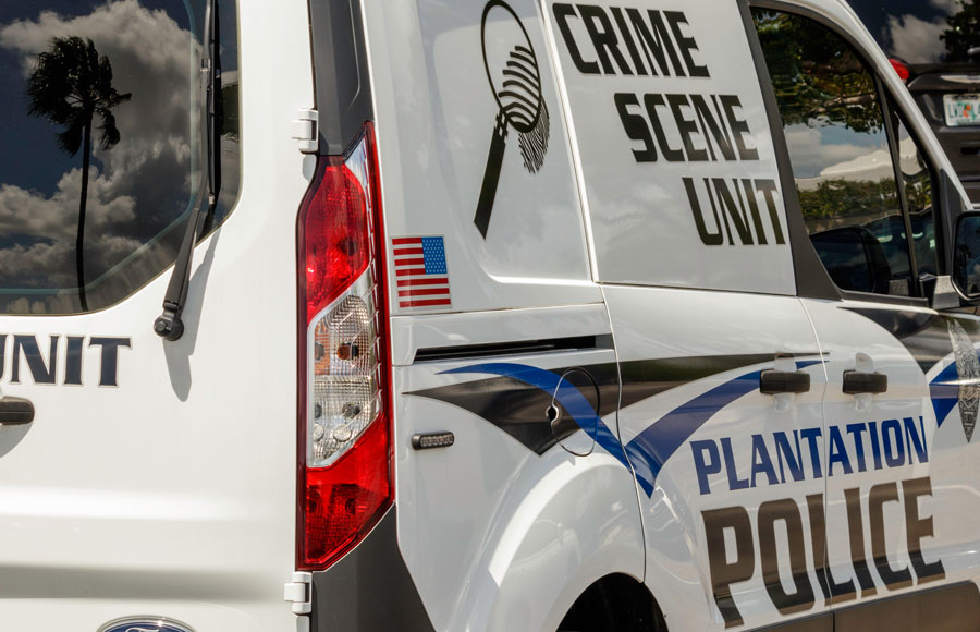 Plantation Police Crime Scene Unit uses a small Ford SUV Van shown here parked in a mall parking lot.