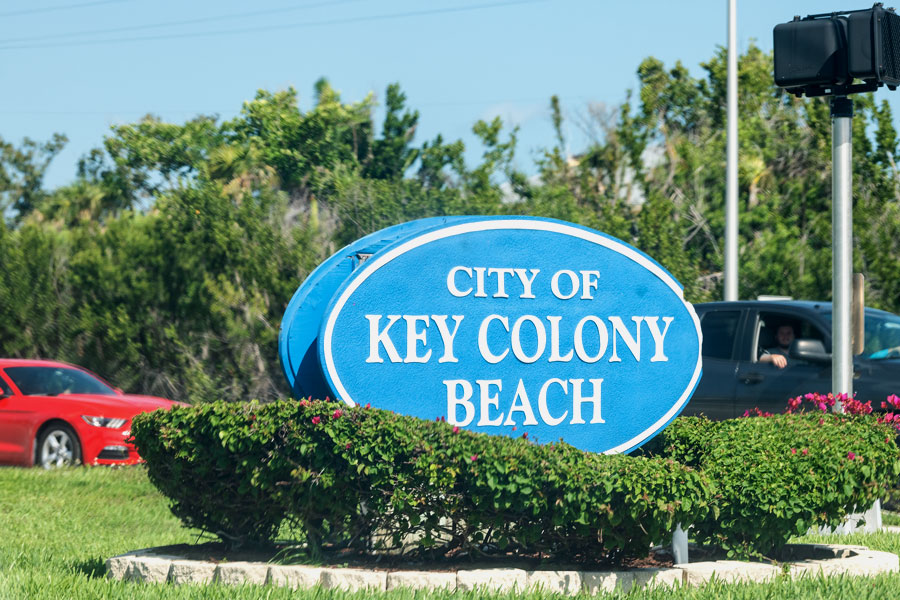 A closeup of the blue and white sign for the city of Key Colony Beach, in the Florida keys on a sunny summer day. Key Colony Beach, Florida, May 1, 2018.