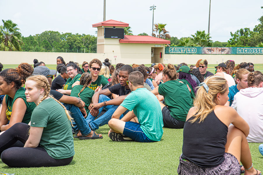 A group of students in the field gathering for an activity at Saint Leo University, Saint Leo, FL, August 14 2019.