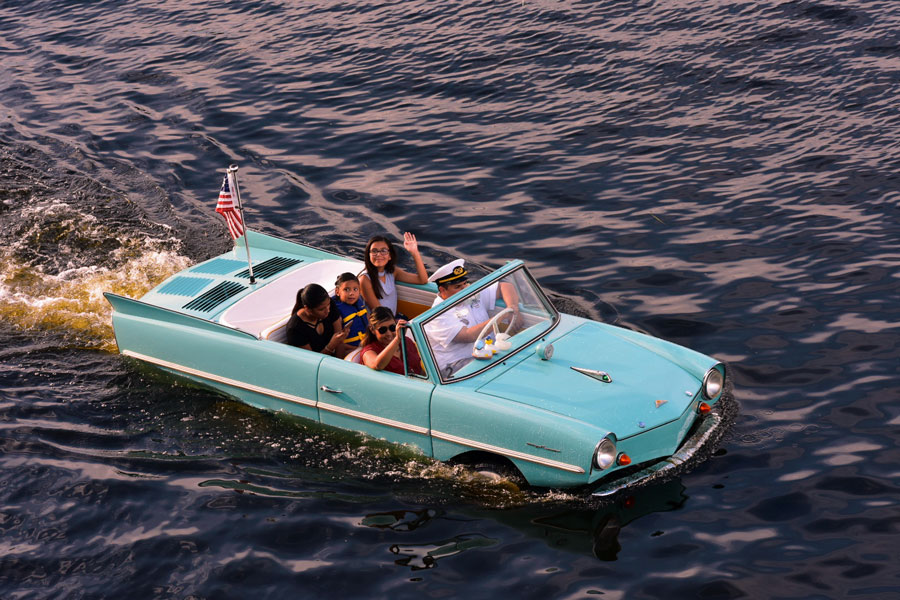 20-minute guided tour on the waters of Lake Buena Vista while riding in a vintage Amphicar—a rare amphibious vehicle that can drive on land and float on water.