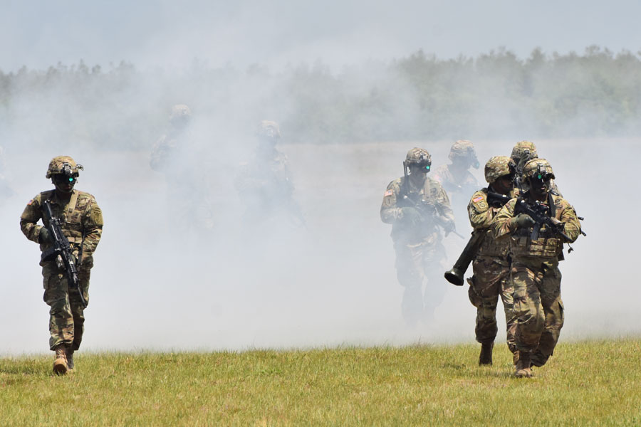 Members of the 6th Ranger Training Battalion complete a training exercise with a smoke obscurant. 