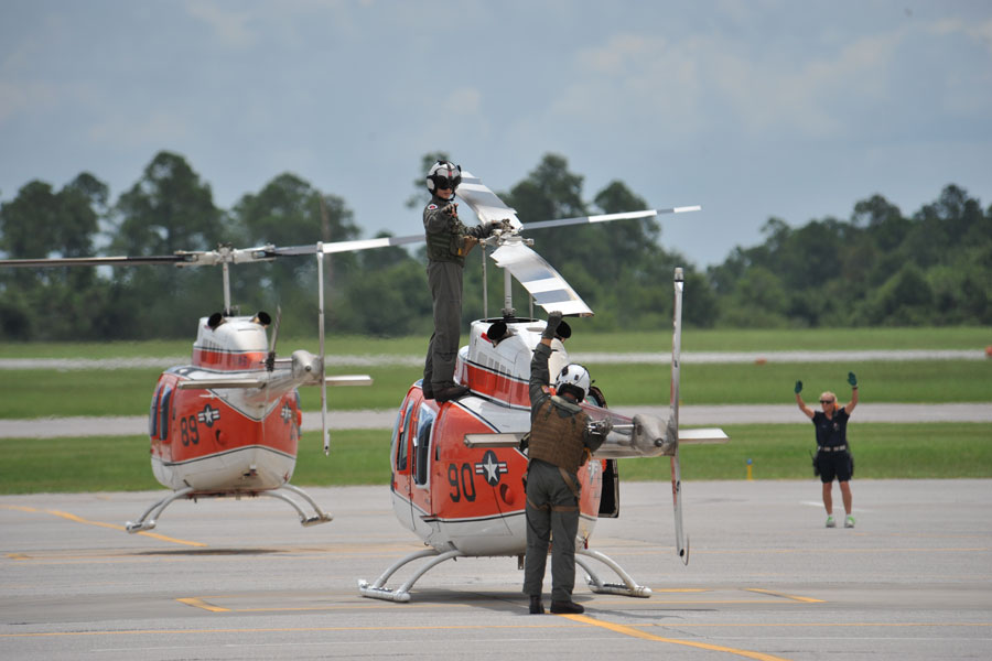 Instructors and Student Aviators prepare for helicopter training flights on Naval Air Station Whiting Field located in Milton, Florida.