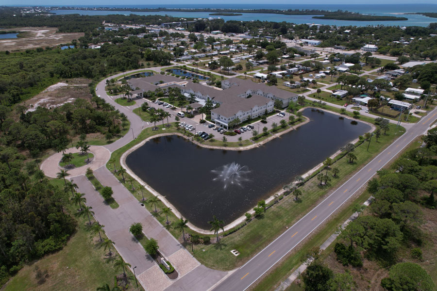 Aerial view of Heritage Oaks of Englewood. A Community Assistant living with beautiful view of the lake and fountain. Englewood Florida April 17, 2022.